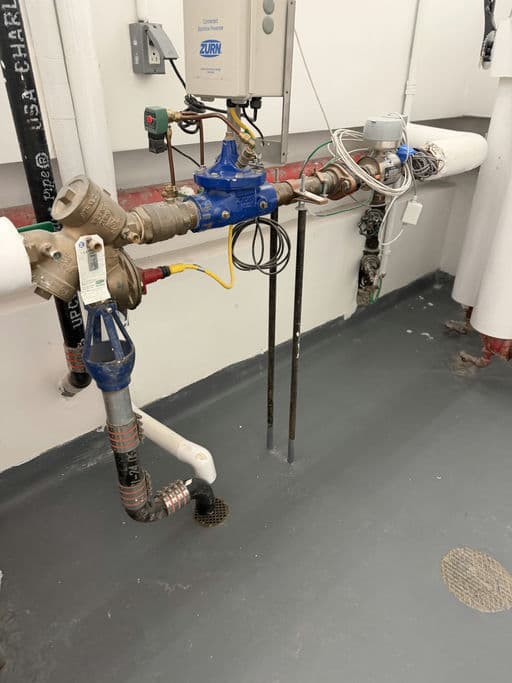 Zurn reduced pressure zone backflow preventer installed in a NYC mechanical room